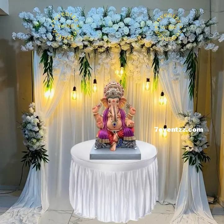 White Floral Setup For Ganpati